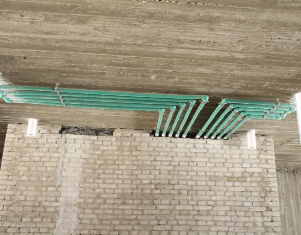 Cable trays installed along a wall